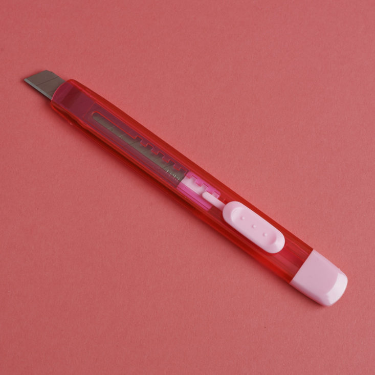 pink paper cutter with blade exposed