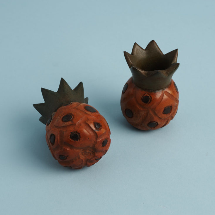 wooden pineapple candle sticks showing bottom of one