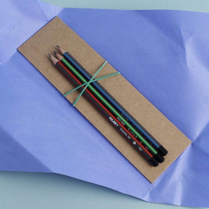 pencils secured by rubber band