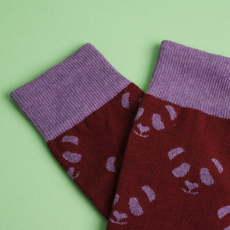 close up of Purple and maroon panda socks