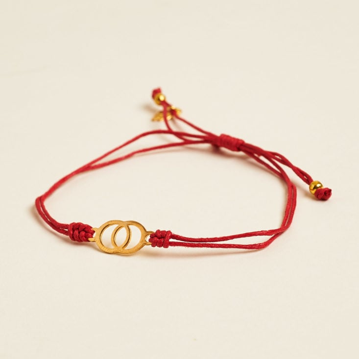 goddess provisions red bracelet and gold charm
