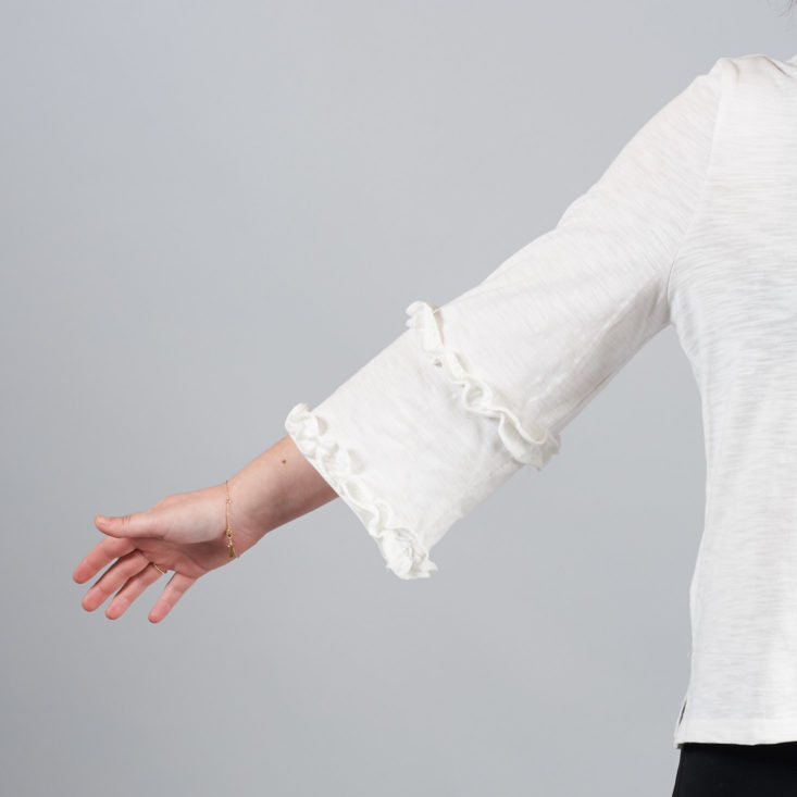 golden tote white bell ruffle sleeve