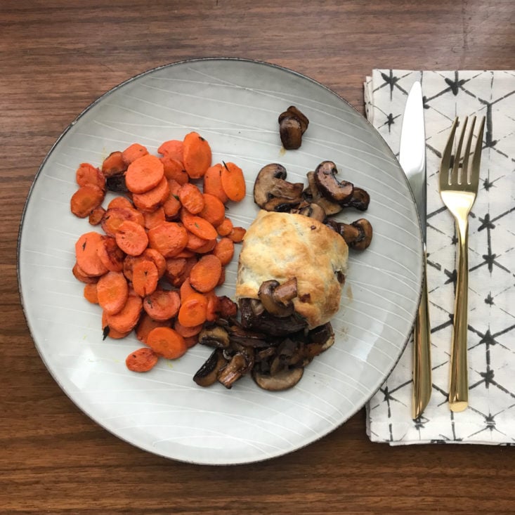finished steak wellington and carrots on plate