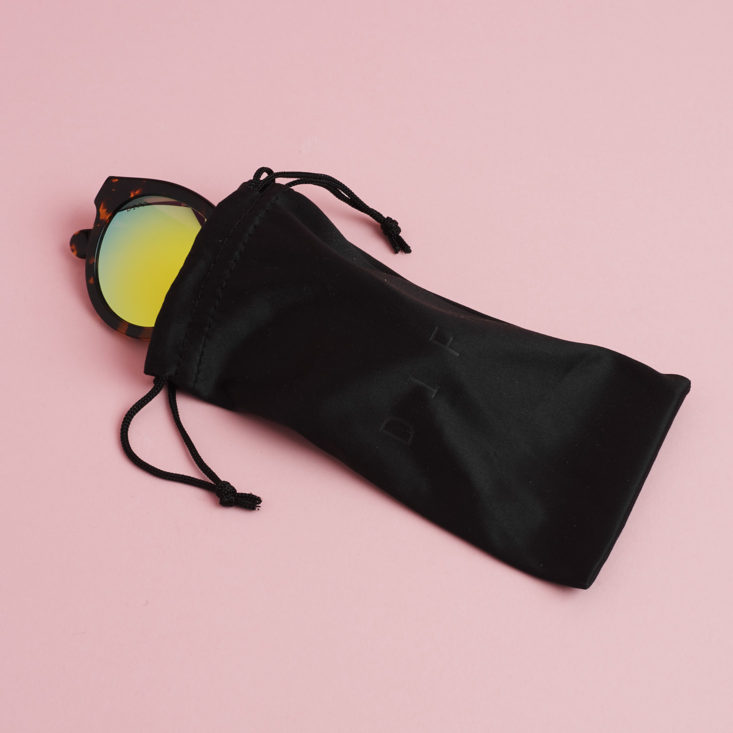 Dime II Sunglasses by DIFF Eyewear coming out of pouch
