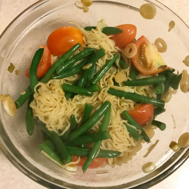 noodles mixed with veggies and sauce