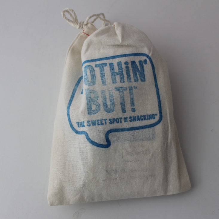 cotton cinch bag with "Nothin' But!" printed in blue