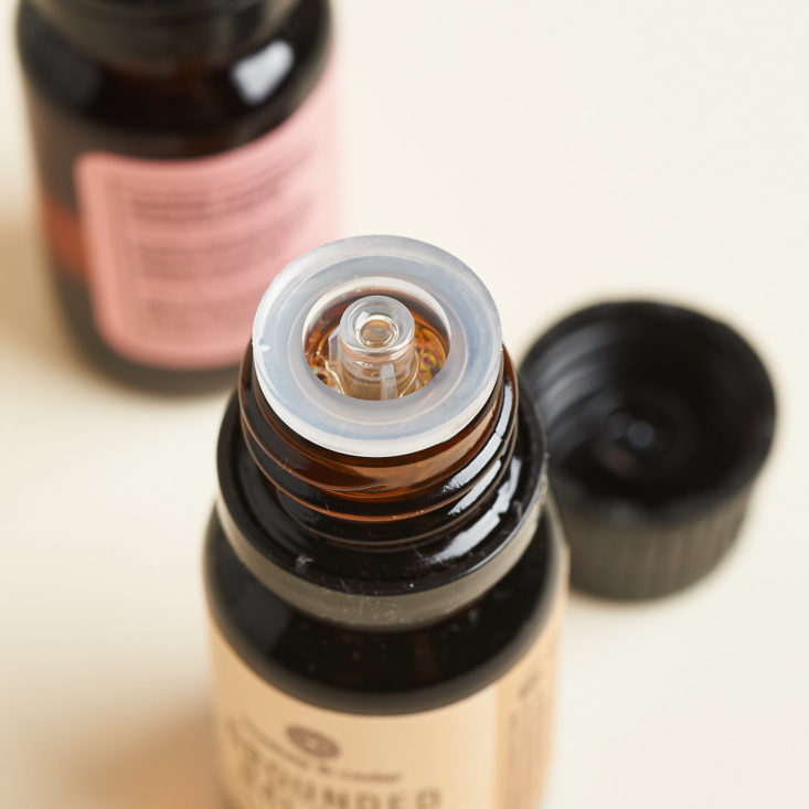 bombay and cedar top of essential oil bottles