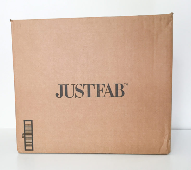 closed cardboard box with justfab printed on the side in black