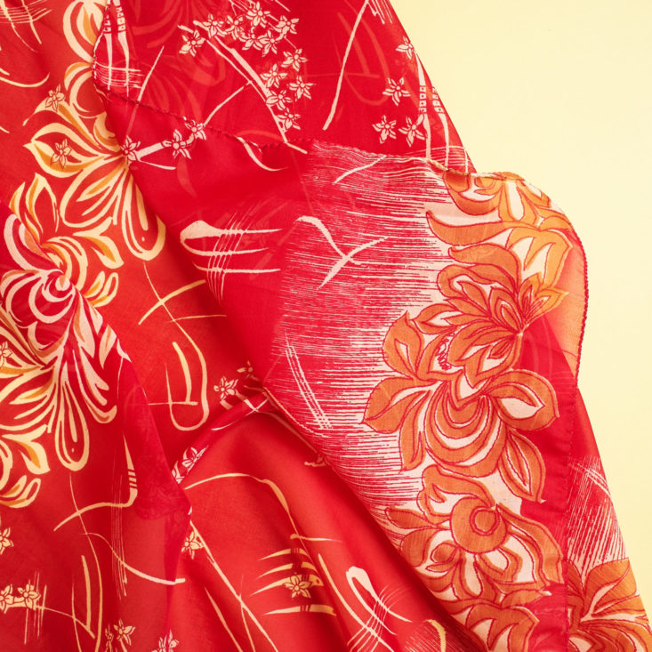 Globe In Celebrate patterned red napkin