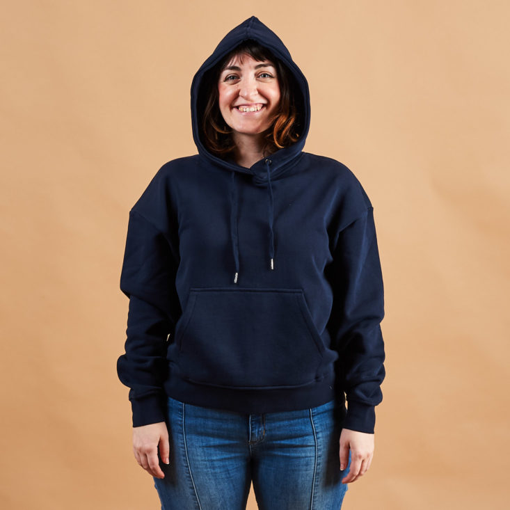Frank and Oak navy pullover hoodie on model with hood up