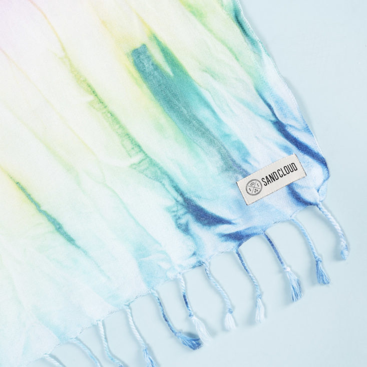 close up of tag and fringe for and Cloud Wanderlust Towel