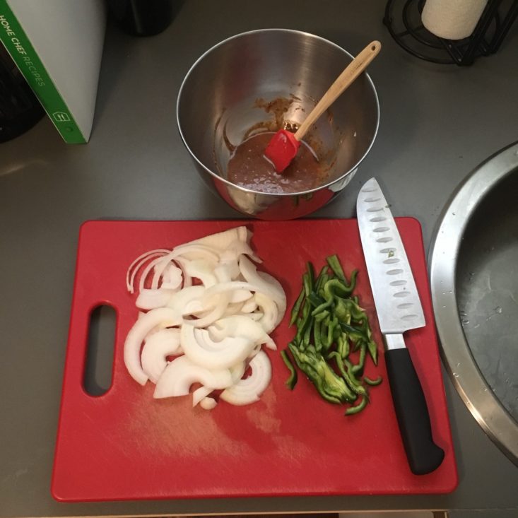 prep work with chopped veggies and mixed sauce