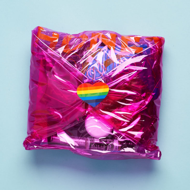 Bright Pink holographic package sealed with a rainbow heart sticker