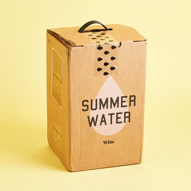 unopened winc box with a summer water advertisement print on the front