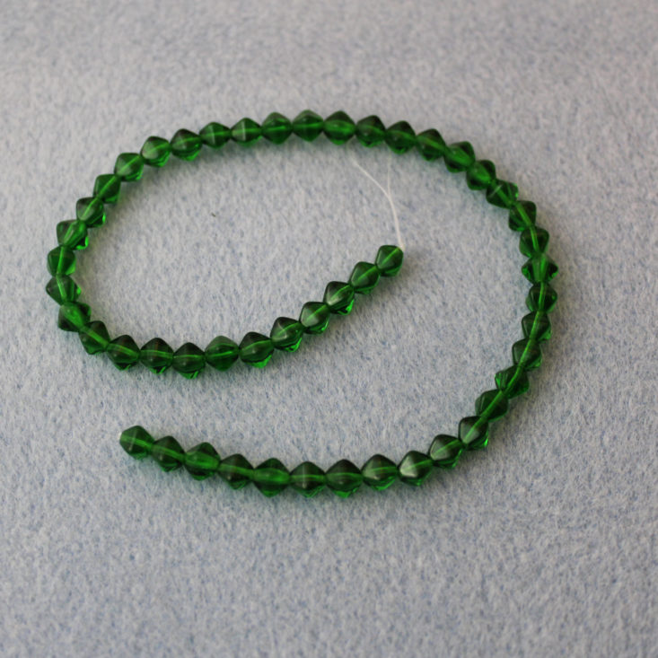 Bead Crate August 2019 - 6 x 6mm Emerald Green Bicones Top