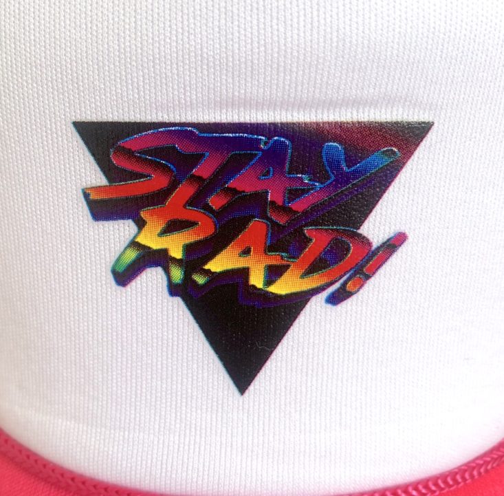 close-up of stay rad graphic on the trucker hat