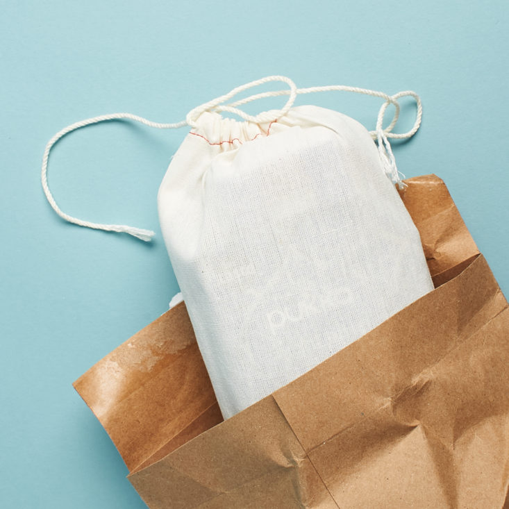 open envelope with linen pouch inside
