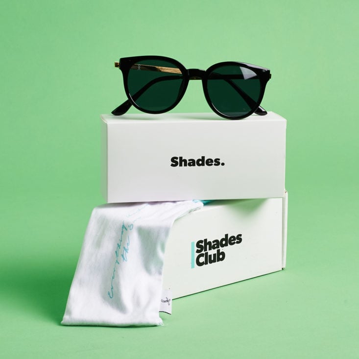 shades club sunglasses on top of boxes
