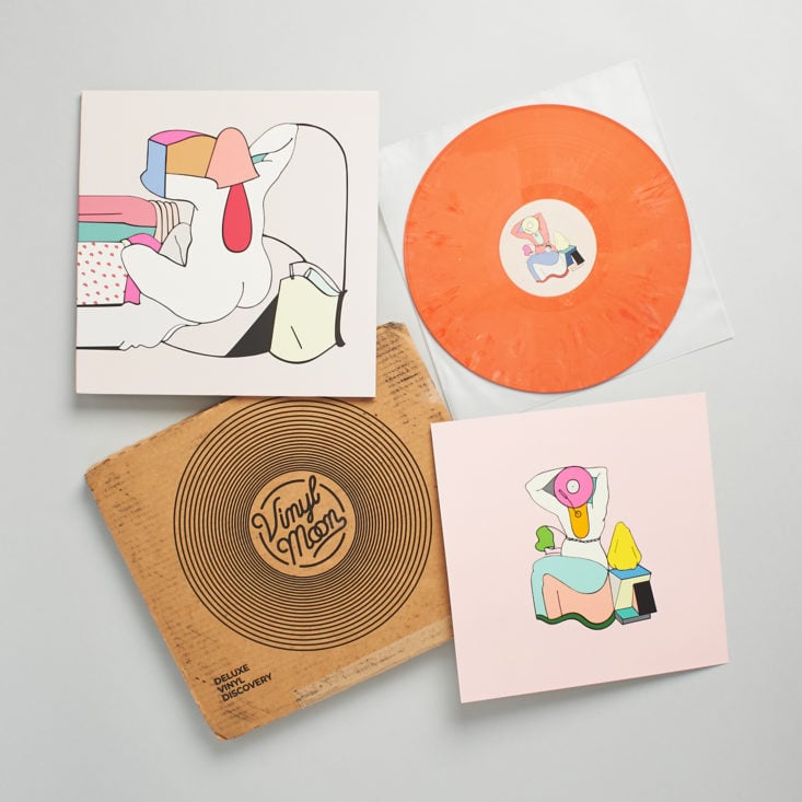 Group shot of Vinyl Moon volume 048 with orange vinyl, cover, print, and mailer