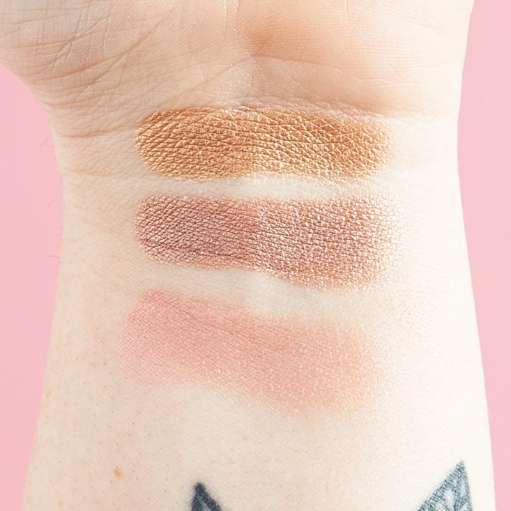trio of highlighter swatches on megans arm